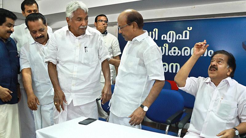 Opposition Leader Ramesh Channithala, Muslim League leader P K Kunhalikutty MP, former chief minister Oommen Chandy and Kerala Congress leaders Anoop Jacob MLA and Johny Nelloor, at the release of a book 1000 days wasted on the poor performance of LDF government in Kochi on Tuesday. (Photo: ARUN CHANDRABOSE)