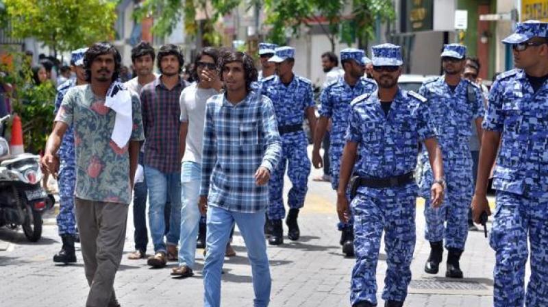In this file photo, Maldives police patrol the streets of the capital Male. (Photo: AFP)
