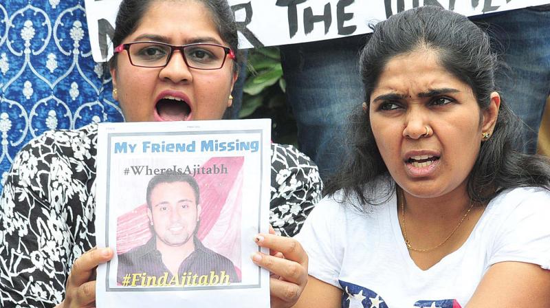 Social workers and software engineers hold up posters demanding a CBI probe into the case of techie, Ajitabh, who went missing on December 18, 2017. The protest was held at Town Hall in Bengaluru on Sunday (Photo: DC)