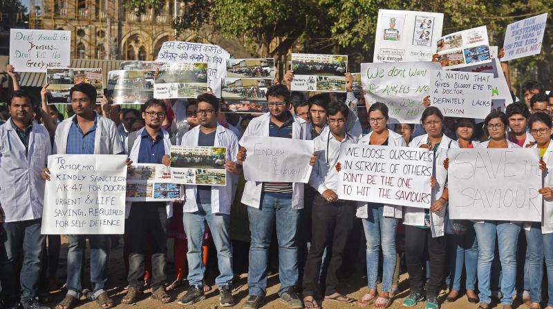 Resident doctors protest at the Azad Maidan demanding security after a intern was assaulted by patients relatives in Mumbai. (Photo: PTI)
