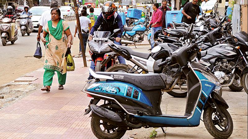 Vehicles parked on the pavement illegally 	R Samuel