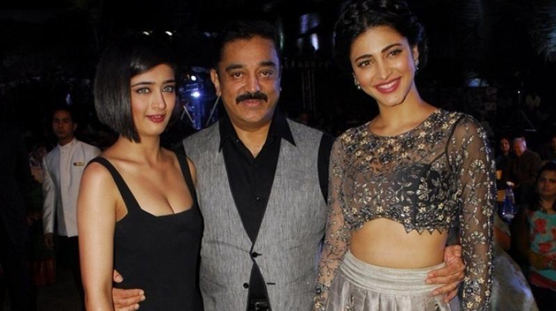 Kamal Haasan with his daughters Shruti (R) and Akshara (L).