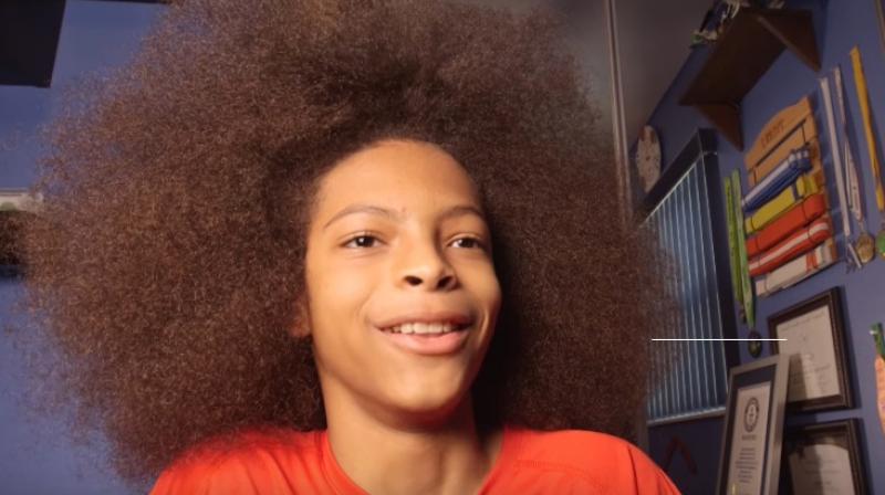 Tyler was inspired to grow his Afro after seeing a photo of his father as a young boy in the 1970s (Photo: YouTube)