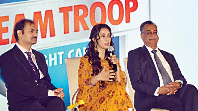 Actress and cancer survivor Manisha Koirala with Dr. H Sudarshan Ballal, Chairman Manipal Hospitals and  Dr Somashekar, Chairman and HOD Surgical Oncology, Manipal Hospitals during a Cancer less Future program at Manipal Hospital, in Bengaluru on Monday (Image DC)