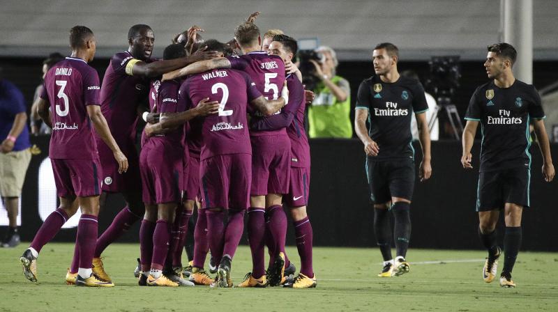 Manchester City players celebrate a goal by John Stones during the second half of an International Champions Cup soccer match against the Real Madrid. (Photo: AP)