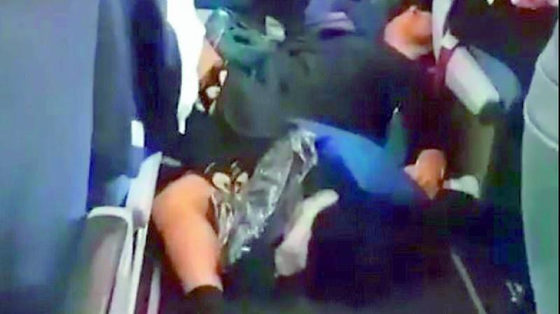 A photo posted online shows passengers on the floor after they were thrown out of their seats.