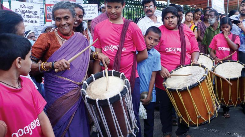 Social activist Daya Bai performing chenda with special needs children in front of the Secretariat in Thiruvananthapuram last year where special school teachers and students had held a seven hour long fast. (File pic)