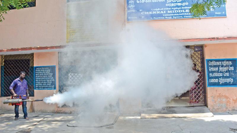 Civic workers perform fogging operations on Thursday at Corporation Middle School in Egmore, ahead of school reopening on Friday (Photo: DC)