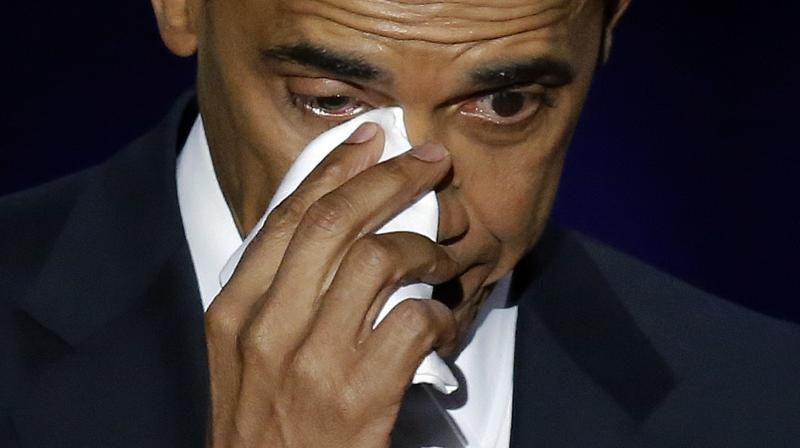 President Barack Obama wipes his tears as he speaks at McCormick Place in Chicago. (Photo: AP)