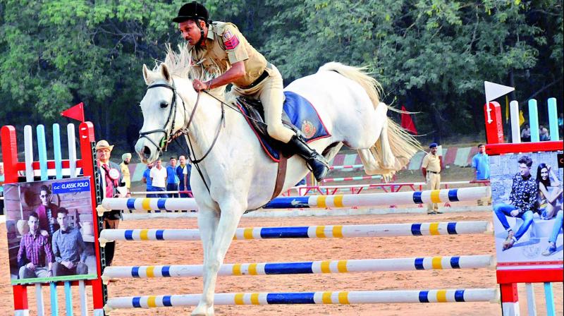 Radheshyam, head constable of the Delhi Police rides his mount Akash on way to winning the six bar jumping event at the Shaktiman 35th All India Police Equestrian Championship at the Sardar Vallabhbhai Patel National Police Academy in Hyderabad on Monday.