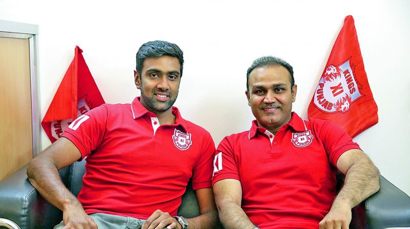 Newly-appointed Kings XI skipper R. Ashwin and Virender Sehwag, mentor of the team.