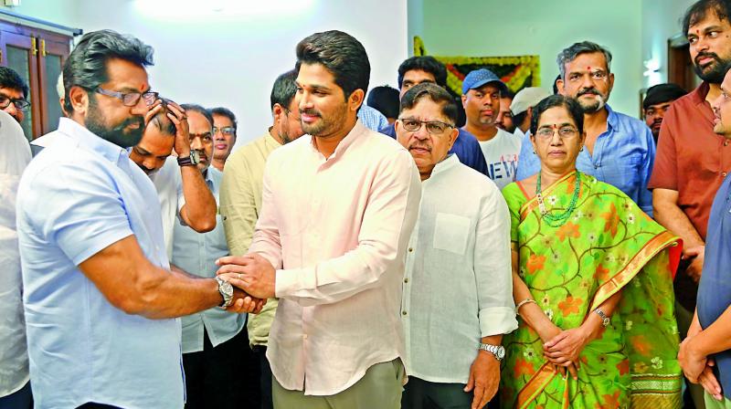 a new start: Allu Arjun along with his father Allu Aravind and Sarathkumar during the launch