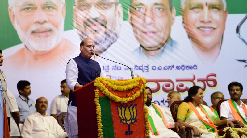 Union Home Minister Rajnath Singh speaks during a public rally to induct the Dalit leader Shivram into the party at National College Ground in Bengaluru. (Photo: PTI)