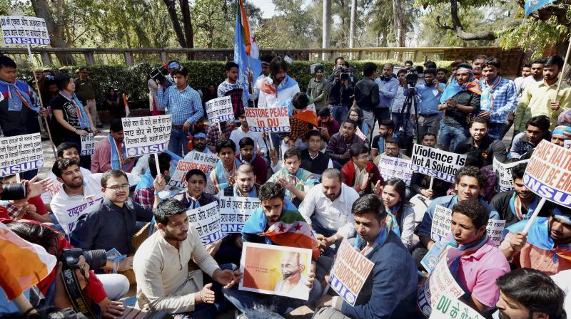 NSUI activists participating in peace unity march at Delhi University in New Delhi on Thursday. ABVP members on Wednesday clashed with AISA students at the North Campus of DU. (Photo: PTI)