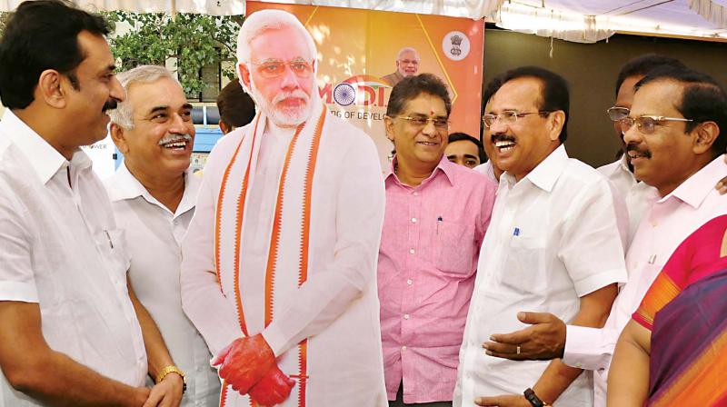 Union Minister D.V. Sadananda Gowda and other BJP leaders at the inauguration of Modi fest at Malleswaram in Bengaluru on Friday (Photo:KPN)