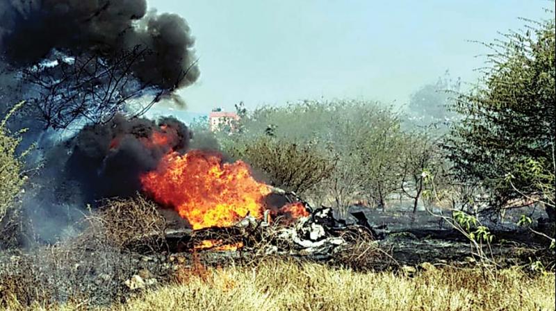 A Mirage-2000 trainer aircraft of the Indian Air Force goes up in flames after crashing at Hindustan Aeronautics Limited (HAL) airport in Bengaluru on Friday 	 KPN
