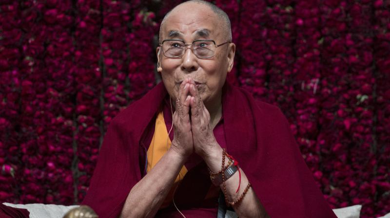 Tibetan spiritual leader the Dalai Lama gestures as he speaks on \Reviving Indian Wisdom in Contemporary India at a public event in New Delhi on Sunday. (Photo: PTI)