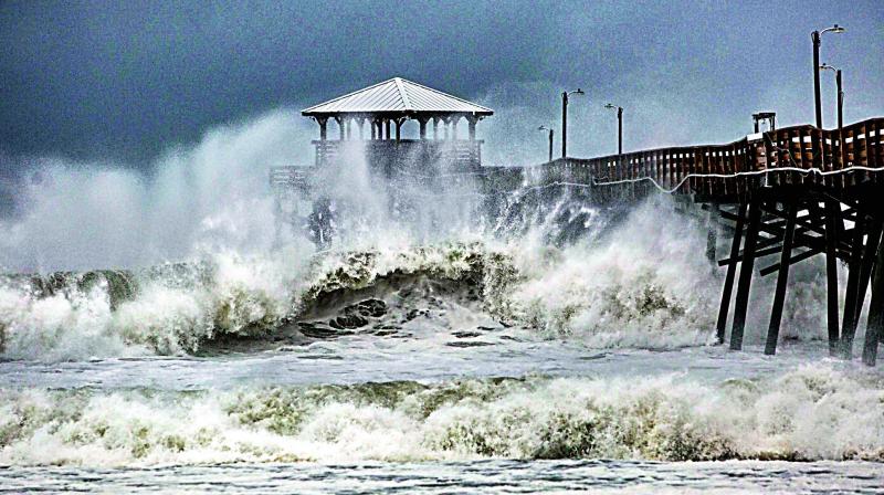 Waves slam the Oceana Pier & Pier House Restaurant in Atlantic Beach, North Caroline on Thursday as Hurricane Florence approaches the area.  (Photo:AP)