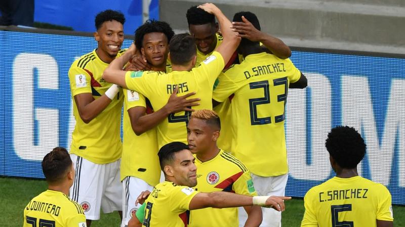 Yerry Mina scored the only goal. The 6-foot-5 (1.95-meter) Barcelona defender leapt above a pair of Senegalese defenders to head the ball hard off the ground, off Senegal goalkeeper Khadim Ndiayes hand and into the net, sending the enthusiastic Colombian fans at Samara Stadium into a frenzy. (Photo: AFP)