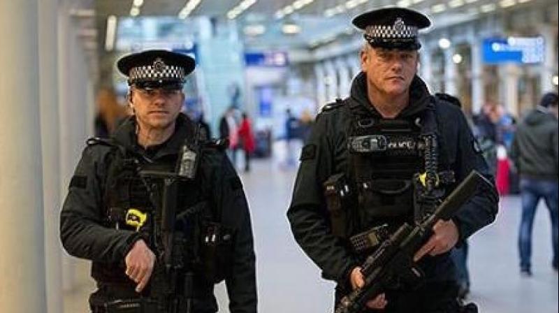 Armed British police patrol St. Pancras train station in London. (Photo: AP)