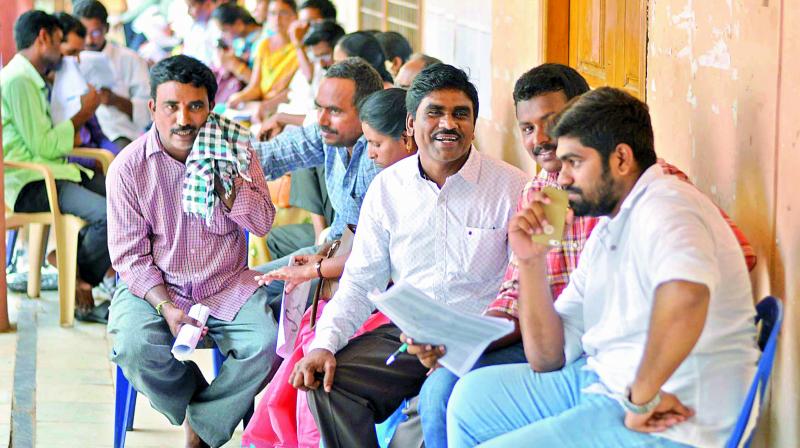 Government teachers at the venue of counselling for transfers in Guntur city on Monday. (Photo: DC)