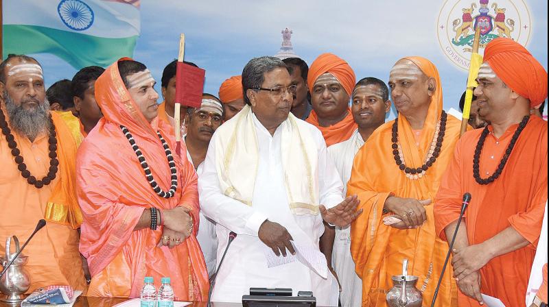 Veerashaiva seers with CM Siddaramaiah in Bengaluru on Thursday 	 DC