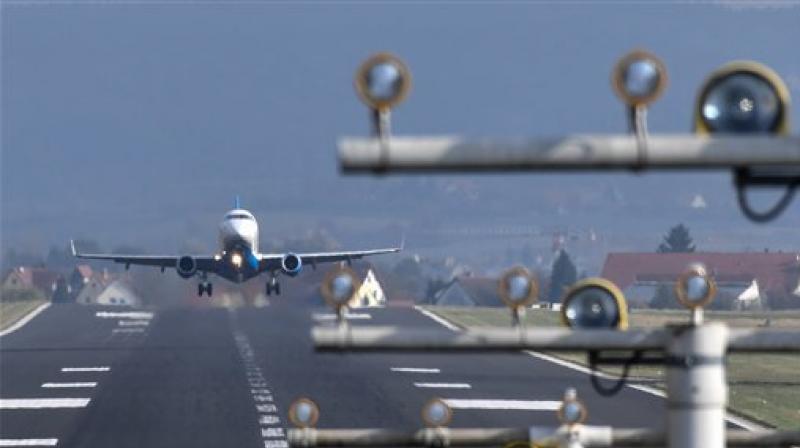 An airplane from the regional airline Peoples Viennaline takes off from the airport on Lake Constance in Friedrichshafen, Germany. (Photo: AP)