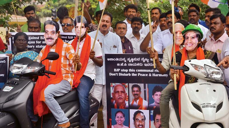 Congress workers protest against the BJP for its attempts to create a communal rift with its recent Mangaluru Chalo rally, in the city on Friday