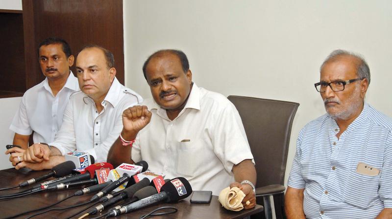 JD(S) state president H.D. Kumaraswamy addresses a press conference in Bengaluru on Friday
