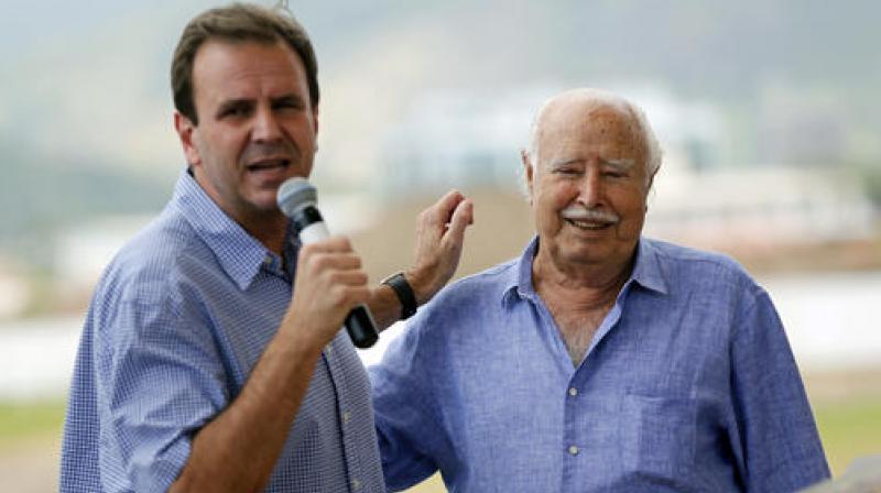 Rio de Janeiro Mayor Eduardo Paes, left, and billionaire developer Pasquale Mauro attend a ceremony at the Olympic Golf Course in Rio de Janeiro, Brazil. (Photo: AP)