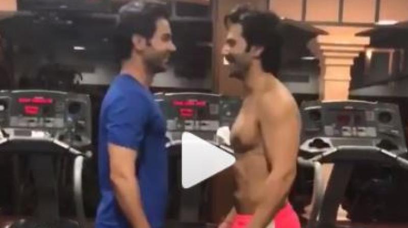 Screenshot from video of Varun Dhawan and Rajkummar Rao at the gym.