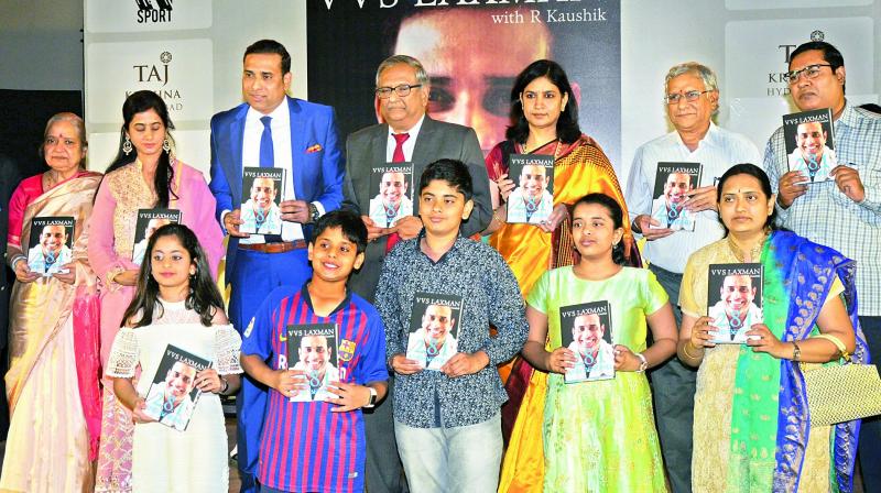 VVS Laxman poses with his family during the book release function of 281 And Beyond in Hyderabad on Thursday.