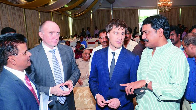 HRD minister Ganta Srinivasa Rao has a word with Governor of Chelyabinsk Region, Russia, Boris Dubrovsky and delegates during an interactive session at a hotel in Visakhapatnam on Friday. (Photo: DC)