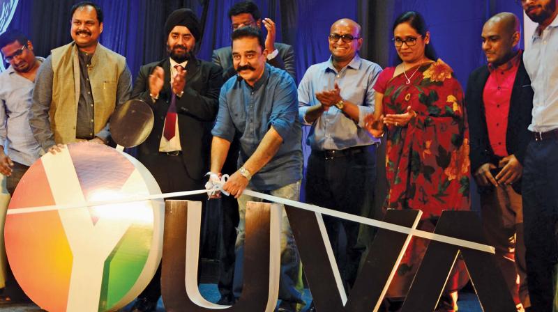 Actor turned politician Kamal Haasan unveiling logo of YUVA, the student wing of Young Indians (Yi) on Sri Krishna College of Engineering & Technology  campus on Wednesday.	 Image: DC