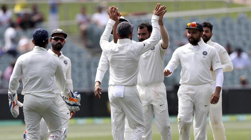While Pat Cummins and Nathan Lyon are putting up a fight, Virat Kohli and co are still the favourites to win the first Test here on Monday and take 1-0 lead in the four-match Test series. (Photo: AP)