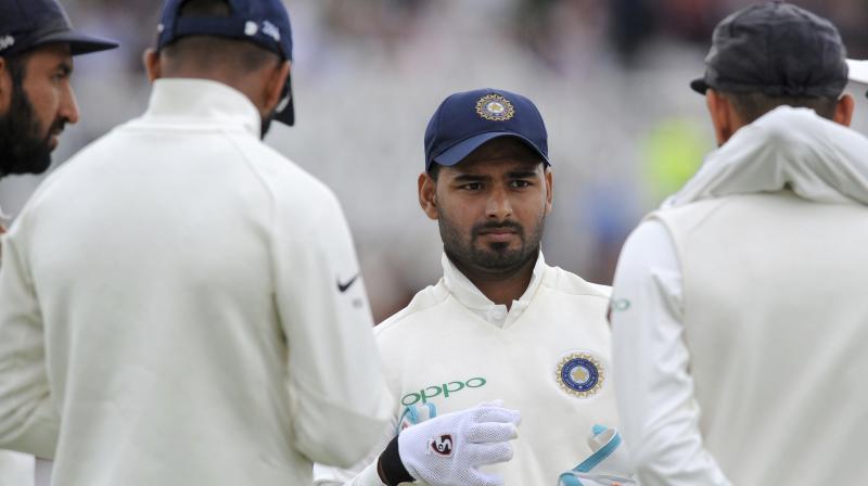 Rishabh Pant Monday equalled the world record of most catches in a Test by a wicketkeeper, snaring 11 in the first match against Australia while breaking the Indian mark. (Photo: AP)
