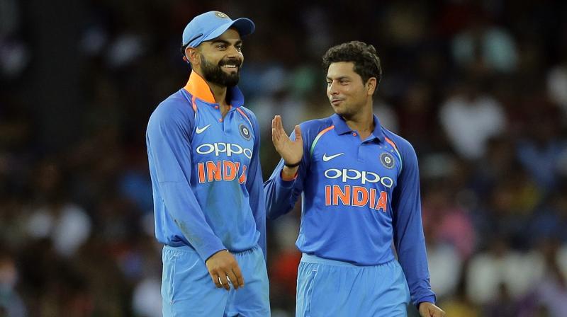 \Virat Kohli is a senior member of the team and he could have encouraged the junior players by sharing the honour,\ Kuldeep Yadavs coach Kapil Pande said. (Photo: AP)