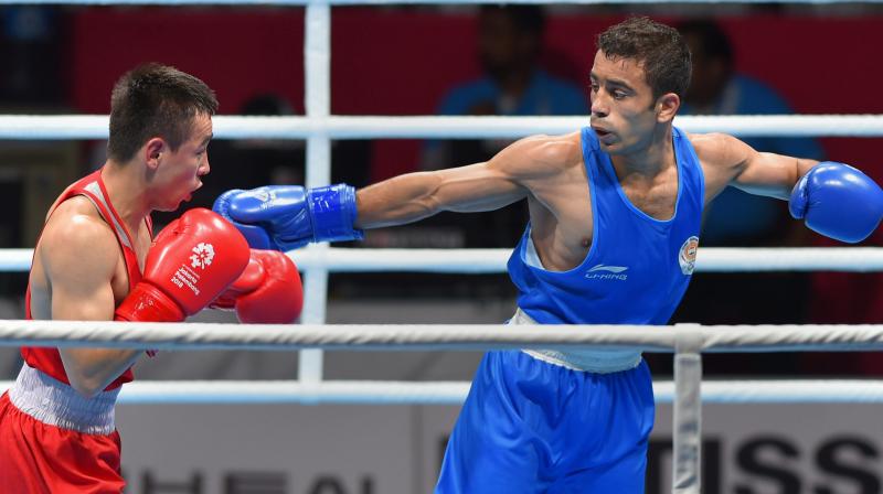 Amit Panghal (Blue) displayed a soldiers grit to stun the reigning Olympic champion for Indias only boxing gold and two 50-plus bridge players proved that age is just a number with their top finishes as the country achieved its best ever medal haul at the Asian Games. (Photo: PTI)