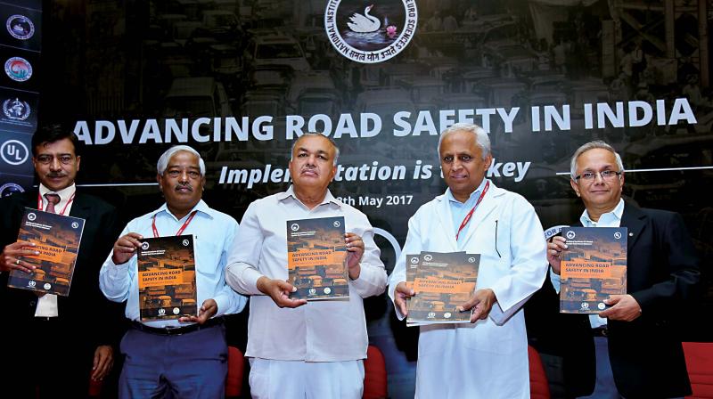 State Transport Minister R Ramalinga Reddy (Centre) unveiling the national level research report on road traffic titled Advancing Road Safety in India: Implementation is the Key in Bengaluru on Friday