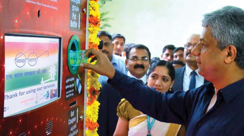 KMRL MD Elias George inaugurating the recycling machine at Palarivattom metro station on Wednesday. (Photo: DC)