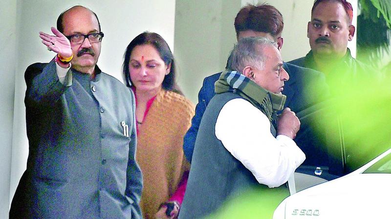 SP patriarch Mulayam Singh Yadav on his way to meet the Election Commission in New Delhi on Monday. SP leaders Amar Singh and Jaya Prada are also seen.  	(Photo: PTI)