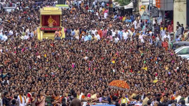 Hundreds of devotees, mostly women, take part in the namajapa (chanting the name of Lord Ayyappa ) during march in Kottayam on Saturday. (Photo: PTI)