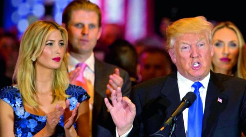 Republican presidential candidate Donald Trump is joined by his daughter Ivanka and son Eric. (Photo: AP)