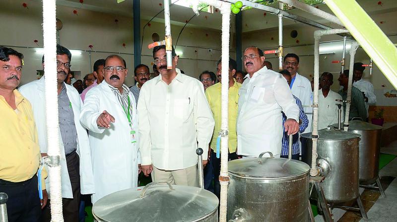 Health minister Kamineni Srinivasa Rao and Vizag MP K. Haribabu inspect the equipment after inaugurating the renovated Diet Kitchen at King George Hospital in Vizag on Monday. (Photo: DC)