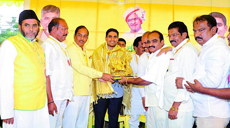 TD leaders and activists felicitate party national general secretary N. Lokesh at the  partys review meeting at NTR Bhavan in Guntur on Monday. (Photo: DC)