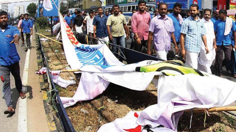 The banners and publicity materials of DYFI at Marine Drive vandalised allegedly by KSU and INTUC workers. (Photo: DC)