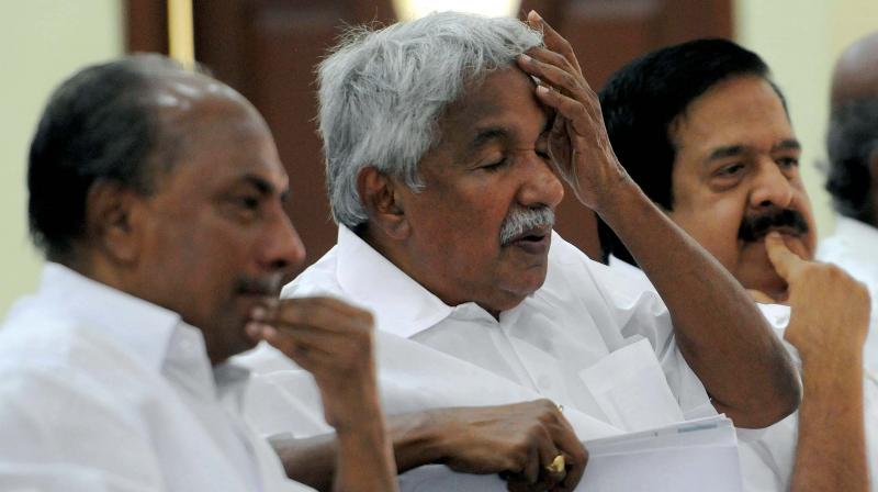 Senior Congress leader A.K. Antony, Former Chief Minister Oommen Chandy and Opposition Leader Ramesh Chennithala before the KPCC executive meeting at Indira Bhavan in Thiruvananthapuram on Saturday.	 (Photo: DC)