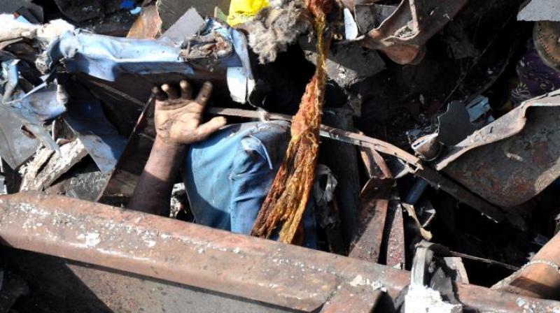 The bodies lying buried amid the remains of the crashed bogies of Hirakhand Express. (Photo: NARASIMHA MURTHY)