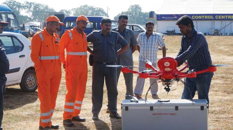 Indian Air Force officials monitoring the performance of new Unmanned Aerial Vehicle (UAV) developed by Anna University at Bengaluru. (Photo: DC)