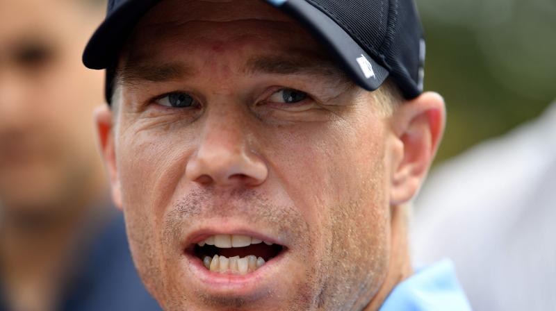 David Warner left the field mid-innings on 35 after \hurtful\ comments from the brother of ex-Test teammate Phillip Hughes but returned shortly afterwards following the intervention of teammates, and went on to score a majestic 157. (Photo: AFP)